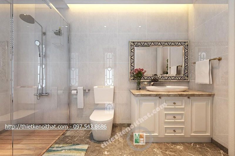Mẫu tủ lavabo gỗ và đá ốp tủ vân mây vàng cao cấp được sử dụng cho phòng tắm.